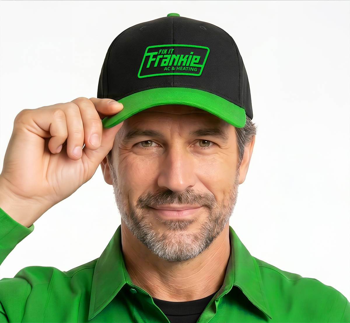 Fix it Frankie smiling in a black branded cap and bright green uniform shirt